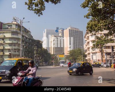 Buildings of the city of Mumbai in the area of Colaba with traffic. Stock Photo