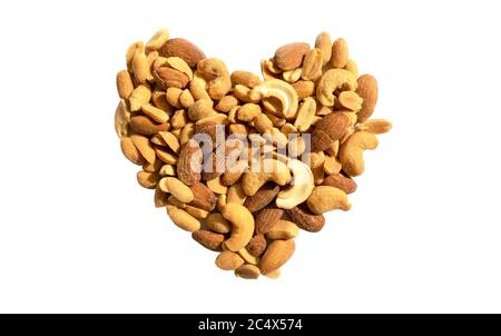 Various nuts in a heart shape isolated on white background. Top view. Different kind of tasty and healthy nuts, snack. Stock Photo