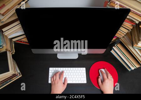 Close up of hands typing keyboard and using mouse at the office. Concept of education and working on computer. Stock Photo