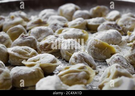 Meat dumplings dazzled and rolled in flour  Stock Photo