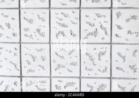 Gray-white concrete texture. Geometric background with square pattern. Close-up Stock Photo