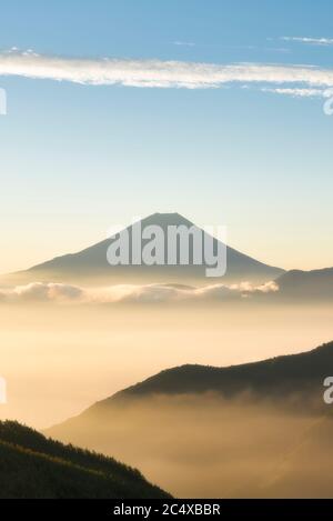 Mt. Fuji over a Sea of Clouds in the Early Morning (Vertical) Stock Photo