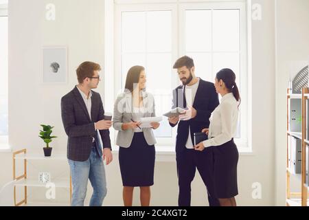 Young business people give new ideas for a new startup project at a meeting in the office. Stock Photo