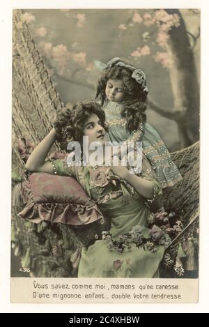 Early 1900's French sentimental tinted greetings card - mother and cute daughter, France, circa 1911 Stock Photo