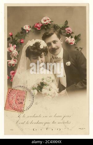 Early 1900's French sentimental tinted greetings postcard - married couple, wishing happiness on this day, posted 19 November 1906 postally used red stamp on front of postcard, France Stock Photo