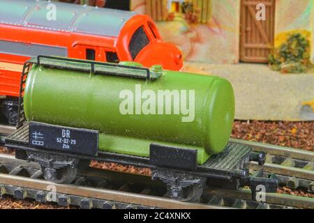 Railway tanker truck. Train hobby model on the model railway. Close-up Stock Photo