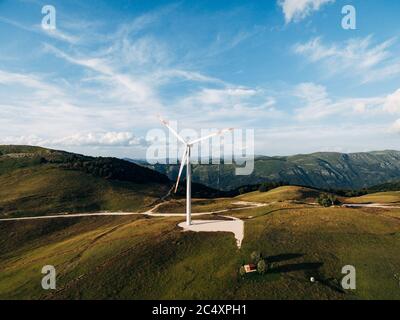 Huge high wind generator in the mountains of Montenegro near the house. Stock Photo