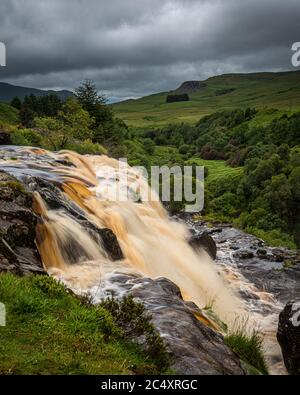 The Loup of Fintry waterfall onf the River Endrick is located approx. two miles from Fintry village, near Stirling. This impressive 94ft waterfall is Stock Photo