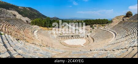 Panorama of Amphitheater (Coliseum) in ancient city Ephesus, Turkey in a beautiful summer day Stock Photo