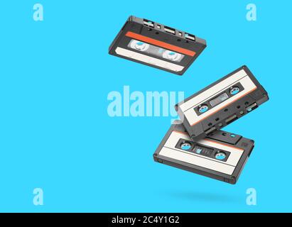 Three retro old audio tape cassettes over blue background Stock Photo