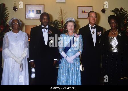 Queen Elizabeth II with The Duke of Edinburgh and Sir Hugh Springer, Governor General of Barbados. his wife Lady Springer and Angelita Sandiford at a State Occasion in Barbados. 1989 Stock Photo