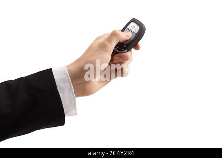 Male hand in a suit pressing a car key isolated on white background Stock Photo
