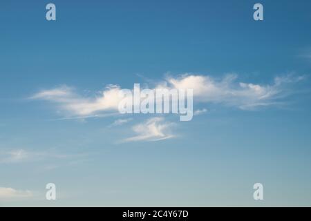 Clear cirrus clouds high up in the sky. Suitable as background or wallpaper. Stock Photo