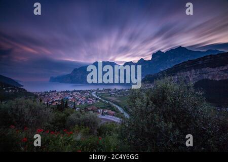 long time exposure of evening sunset  of Torbole, a colorful village at Lago di Garda (Lake Garda), Trentino, Italy; Stock Photo