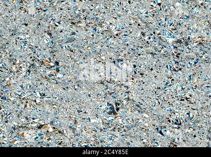 grey aluminium foil texture useful as a background, with color light reflection Stock Photo