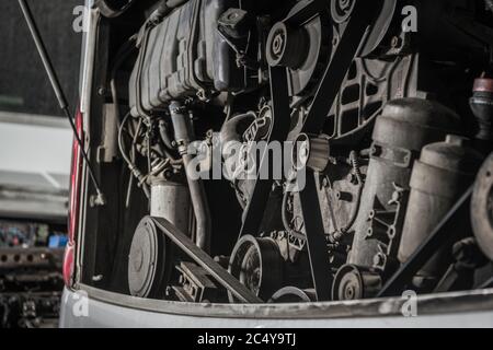 Close Up Of Commercial Coach Bus Engine Components And Elements During Maintenance. Stock Photo