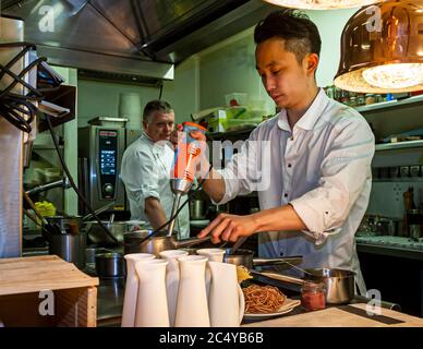 Michelin Star Chef Loic LeBail with Souchef Kazunori Tanigawa in Roscoff, Morlaix, France Stock Photo