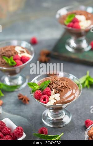 Chocolate mousse with raspberry, mint and almonds Stock Photo