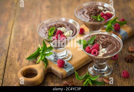 Chocolate mousse with raspberry, mint and almonds Stock Photo