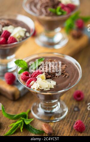 Chocolate mousse with raspberry, mint and almonds Stock Photo