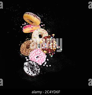 colorful donuts on black background Stock Photo
