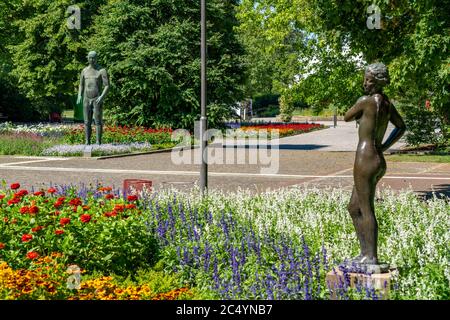 The Grugapark, Essen, botanical garden, park for leisure and local recreation, works of art Grosser Adam, hinten and In Wind und Sonne, colour terrace Stock Photo