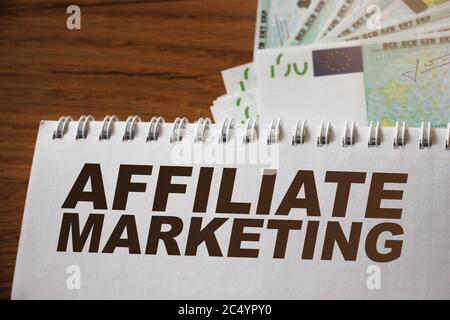 Notepad with words Affiliate marketing, pencil and glasses. Refferals ...