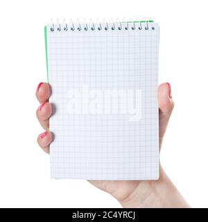 Woman Hand Holding Blank Spiral Notepad on a white background. Stock Photo