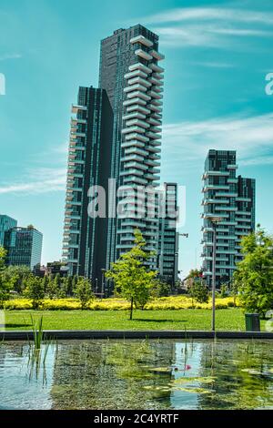 Milan, Italy, 06.29.2020: View from Library Of Trees park, Parco Biblioteca degli Alberi Milano of Futuristic, luxury apartments and offices within th Stock Photo