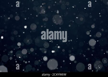 Snowfall on black background Stock Photo