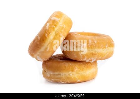 three glazed donuts in a pile isolated on white Stock Photo