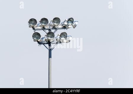 high intensity discharge HID stadium lights on a concrete pole Stock Photo
