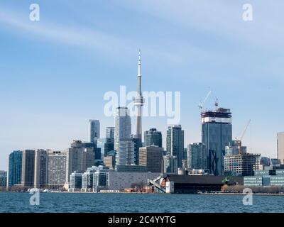Toronto Canada, March 9, 2020; The city of Toronto skyline seen from the East side of the harbour showing financial buildings and CN Tower Stock Photo