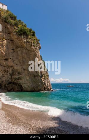 Bay with beach at Praiano, a community of the province of Salerno in the Campania region of southwest Italy and is situated on the Amalfi Coast. Stock Photo