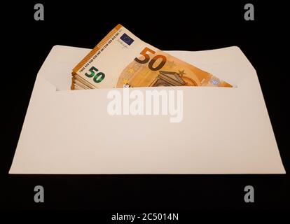 Bunch of euro banknotes in white envelope: various concepts Stock Photo
