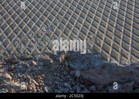 Old surface of grey cracked textured concrete slab, can be used as a background Stock Photo