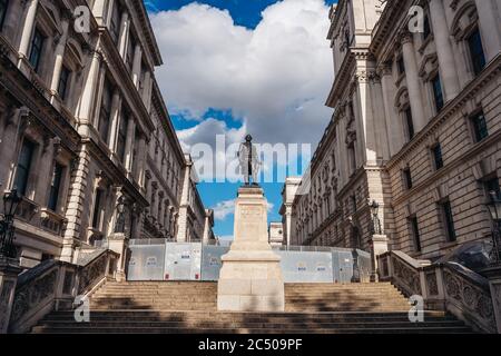 London / UK - 06/28/2020: Robert Clive Memorial in front of police cordon wall in central part of the city. Stock Photo
