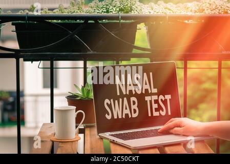 Handwriting text writing Nasal Swab Test. Conceptual photo diagnosing an upper respiratory tract infection through nasal secretion Personal workplace Stock Photo