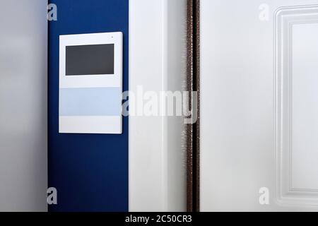 Video intercom on wall. Video door phone. Modern minimalistic sensor panel. Security safety system in rent apartment. Access permission system Stock Photo