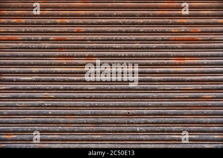 Old Roll-up Garage Gate. Old rusty garage doors. Stock Photo