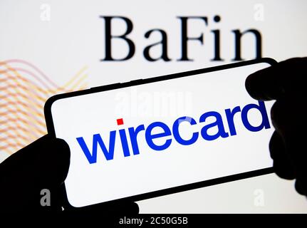 Wirecard logo on smartphone and BaFin (Federal Financial Supervisory Authority) logo on the blurred background. Not a montage. Stock Photo
