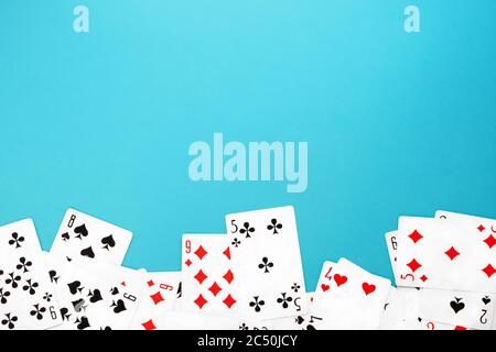 Deck of playing cards on blue background copy space Stock Photo