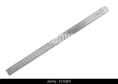 Old metal ruler isolated on white background. Stock Photo
