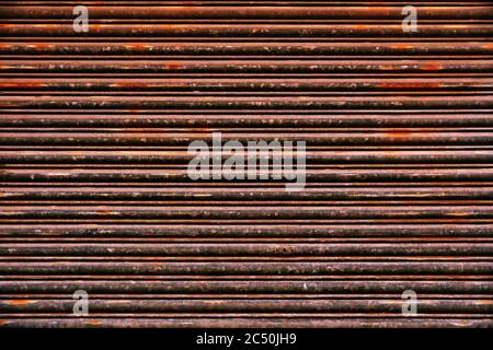 Old Roll-up Garage Gate. Old rusty garage doors. Stock Photo