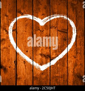 Hand-drawn heart shape contour on a brown wooden board with realistic texture and natural structure. White symbol created with brushstroke Stock Vector