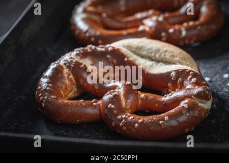 Yummy pretzels freshly on baking tray baked Stock Photo