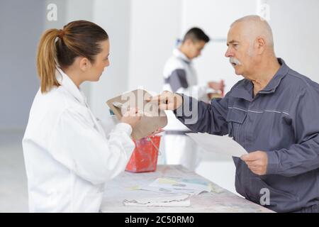 young house painter and decorator apprentice trainee Stock Photo