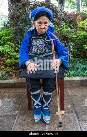 Kunming, China - June 24, 2019: Portrait of a Chinese woman that had her feet bound (footbinding) also called Lotus Feet Stock Photo