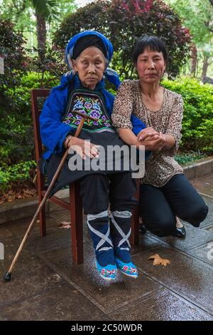 Kunming, China - June 24, 2019: Portrait of a Chinese woman that had her feet bound (footbinding) also called Lotus Feet Stock Photo