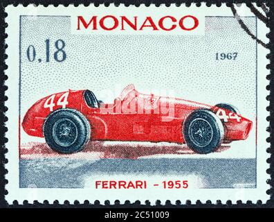 MONACO - CIRCA 1967: A stamp printed in Monaco shows Ferrari Grand Prix racing car of 1955, winner of Monaco Grand Prix, circa 1967. Stock Photo